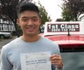 Joseph with Driving test pass certificate